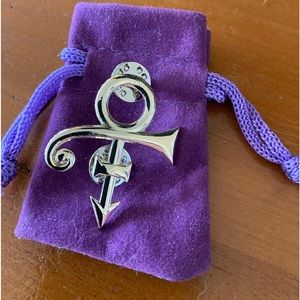 Prince pin gold tone brand new